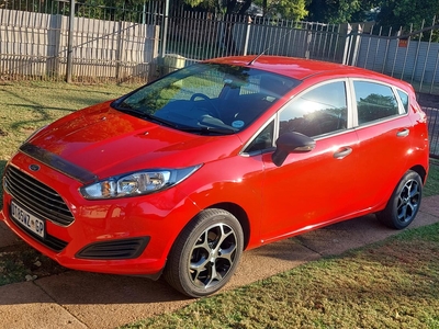 Ford Fiesta 2015 Ambiente 1.4, Red in color, very good condition.