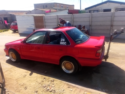 I'm selling my Toyota Corolla 180i red in colour