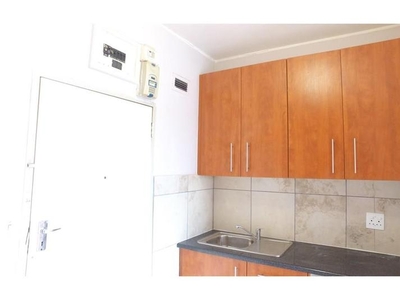 Cozy bachelor apartment is situated in a secure building with access control in Parow.