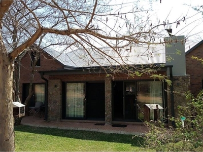 Neat two bedroom house with open plan kitchen, livingroom area and bushveld view.