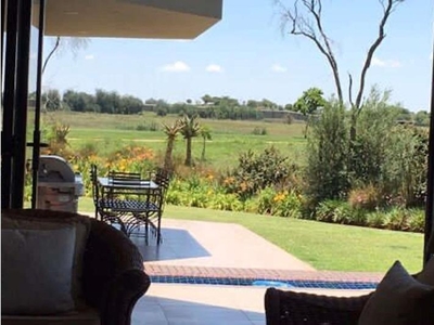 This spectacular modern designed house offers you panoramic fairway views in Serengeti